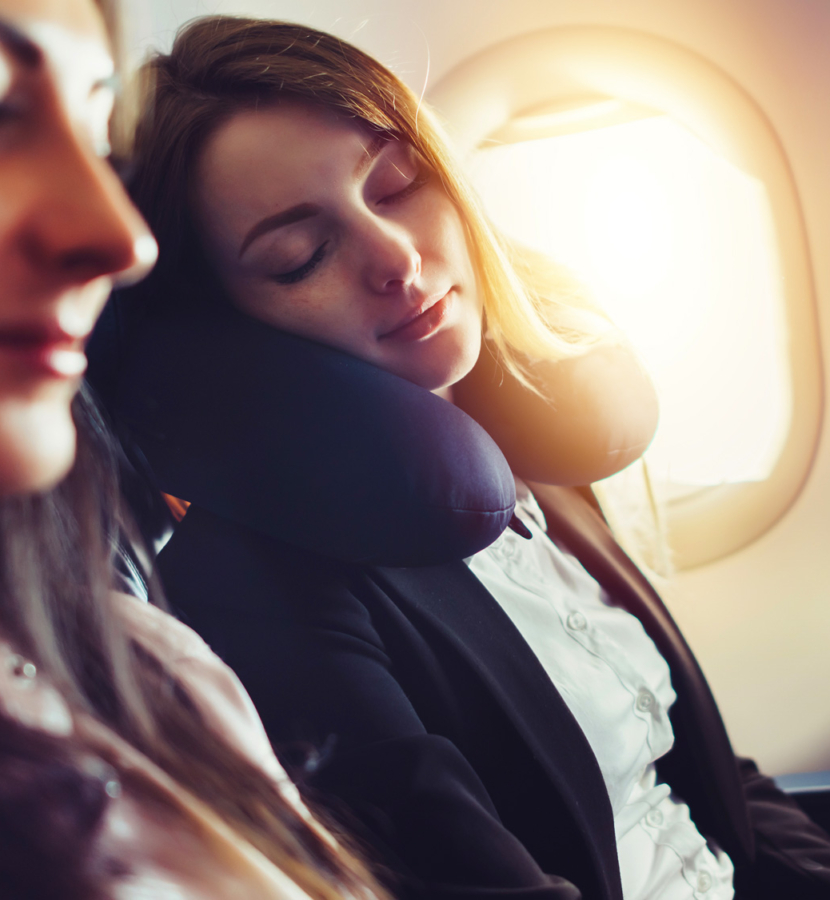Woman sleeping on plane