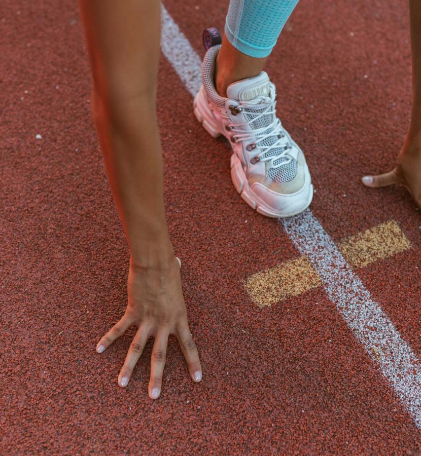 Woman stretching on a track